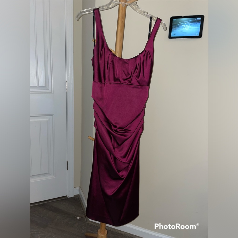 Cranberry evening gown hits just past knee
